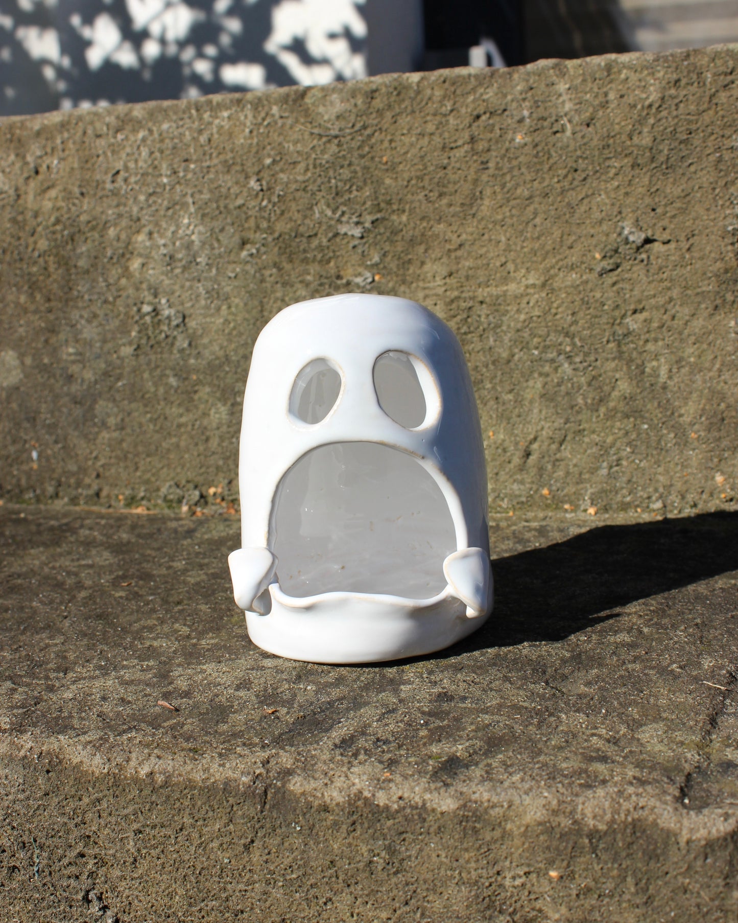 Handmade white ceramic ghost tealight holder — a spooky yet adorable accent for Halloween or cozy home décor