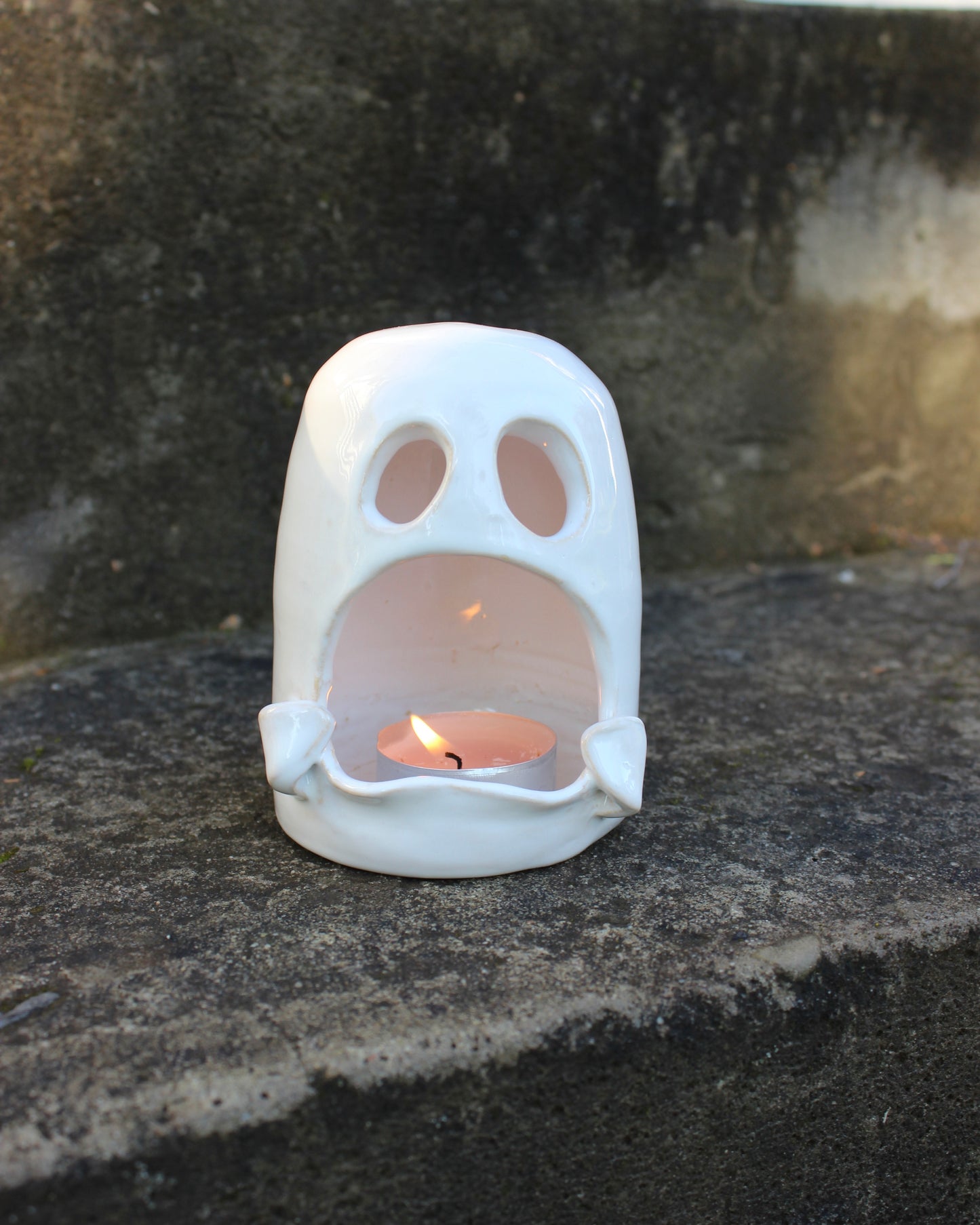 Handmade white ceramic ghost tealight holder — a spooky yet adorable accent for Halloween or cozy home décor